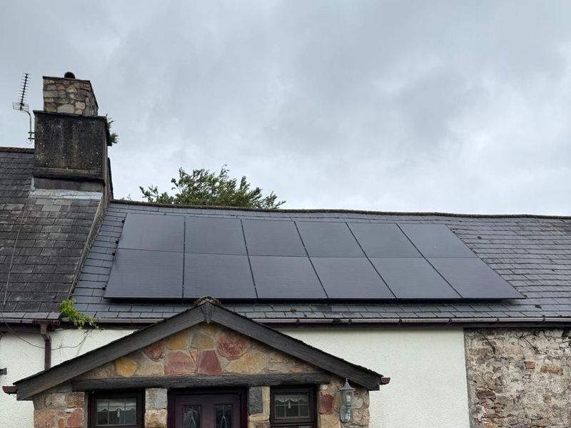 5.4kW solar panel array on the roof of a stone cottage in Monmouthshire, installed by EJS Electrical and Renewables